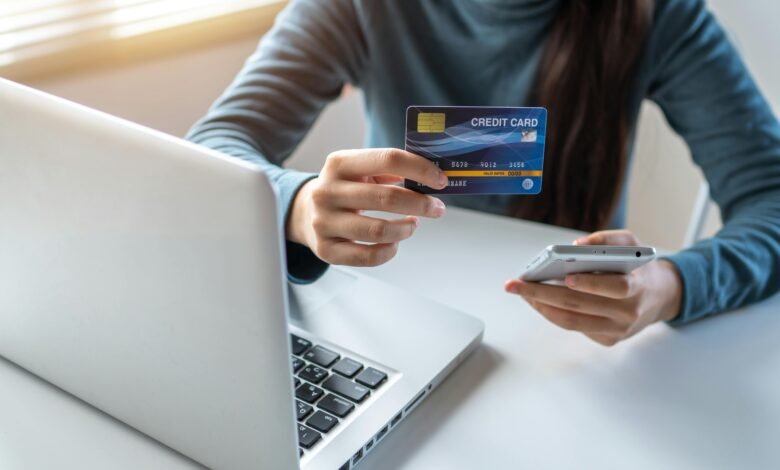 A person using a smartphone to shop online through social media apps with shopping cart icons