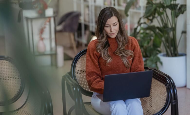 Illustration of a person using Mailchimp for email marketing in 2025, featuring a laptop screen with campaign setup and analytics.
